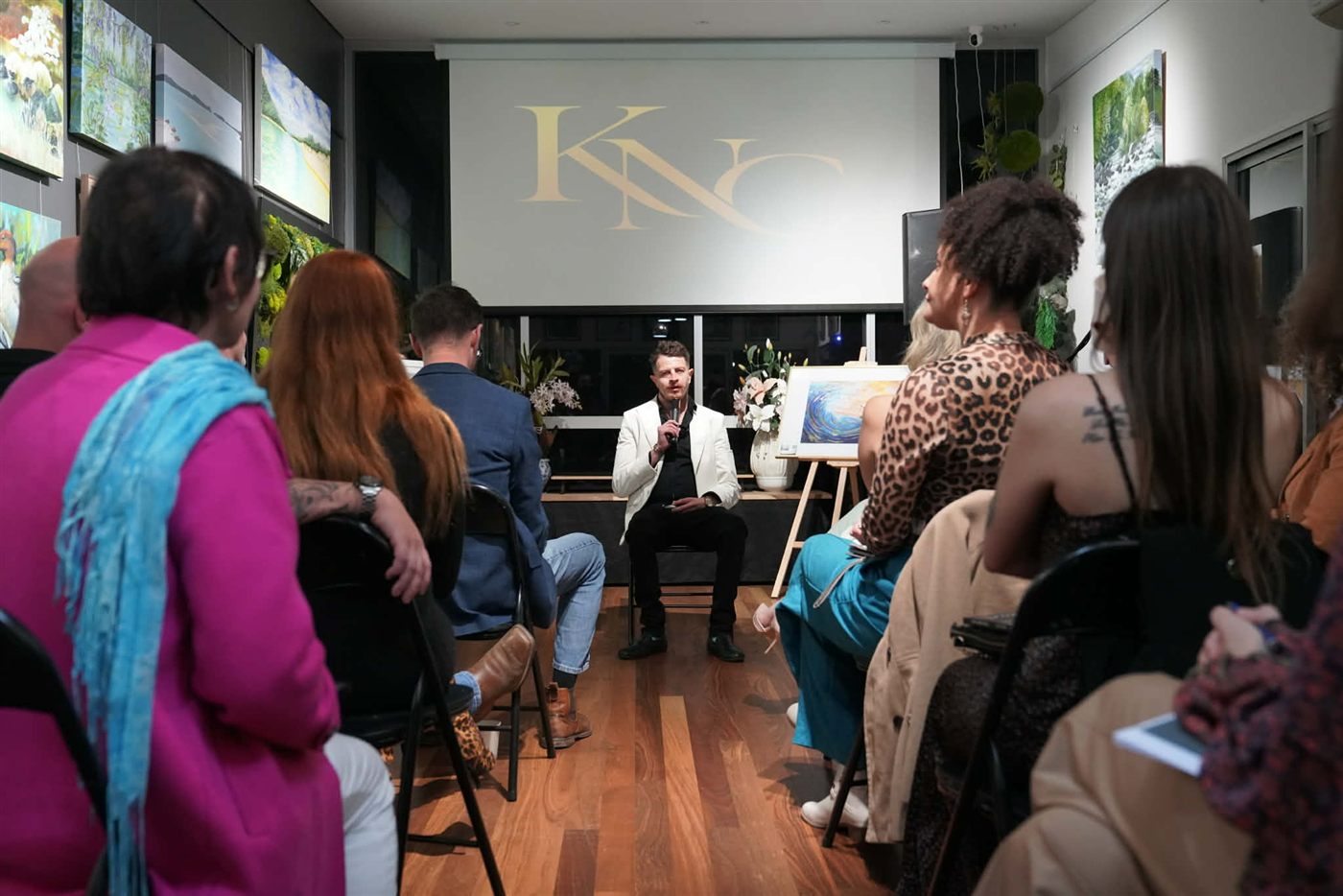Kyal Neil Currant speaking at a live KNC event